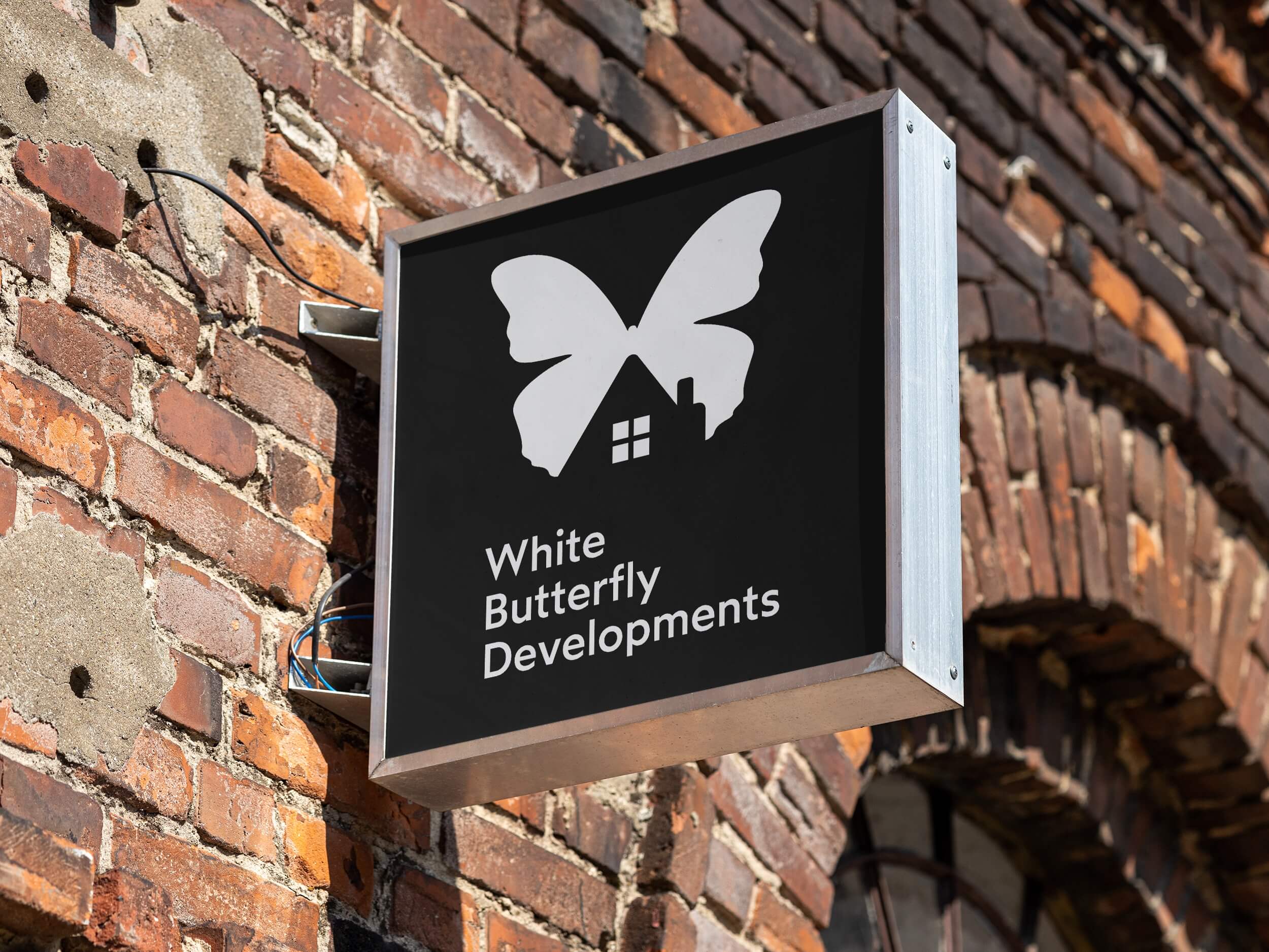 white-butterfly-developments-sign